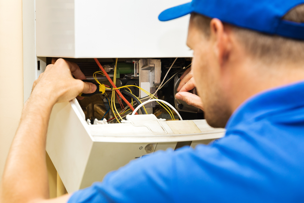 Our employee finishing up an electric heater replacement for a client’s home in Baton Rouge