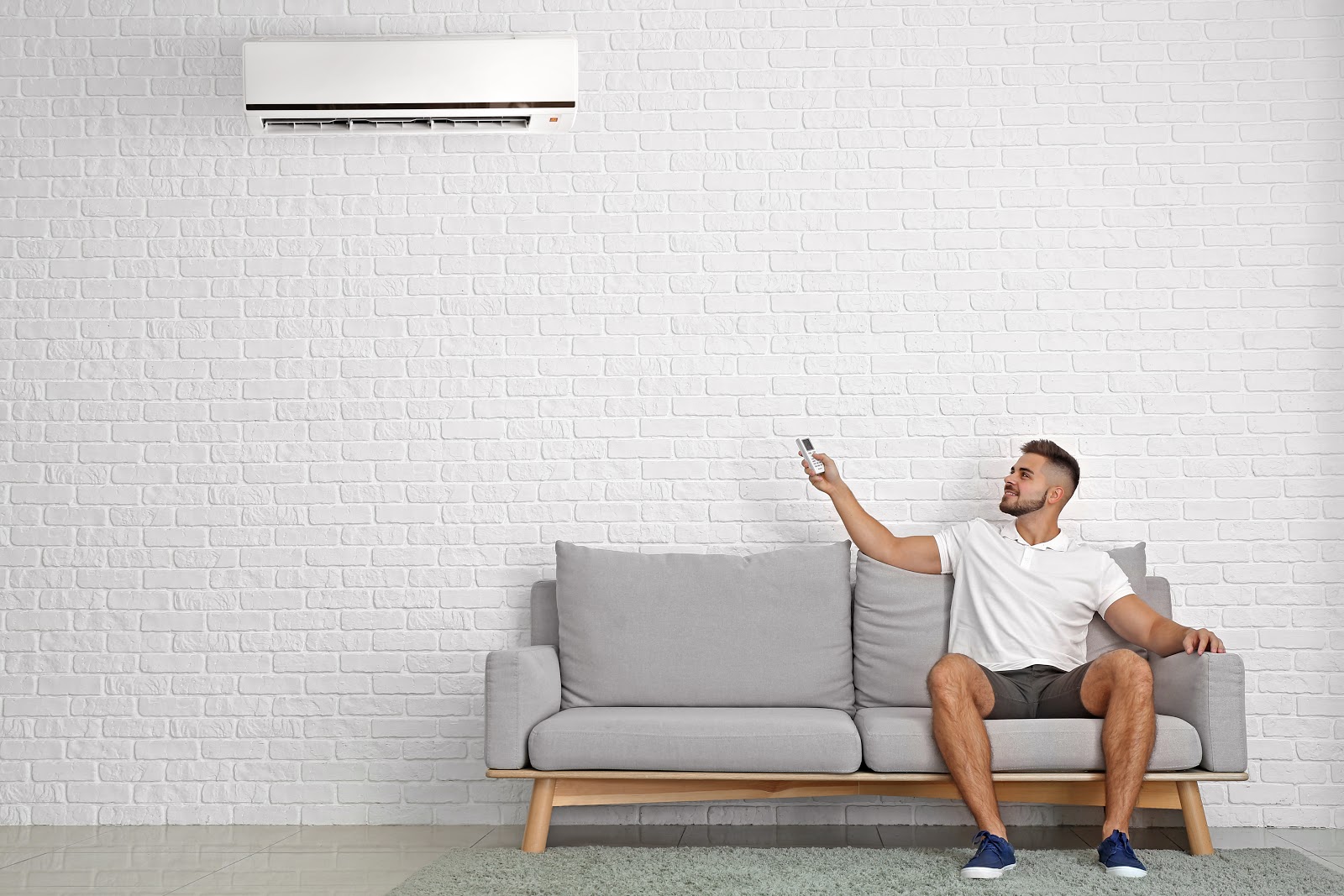 man sitting in New Orleans, LA, home using ductless AC to stay cool