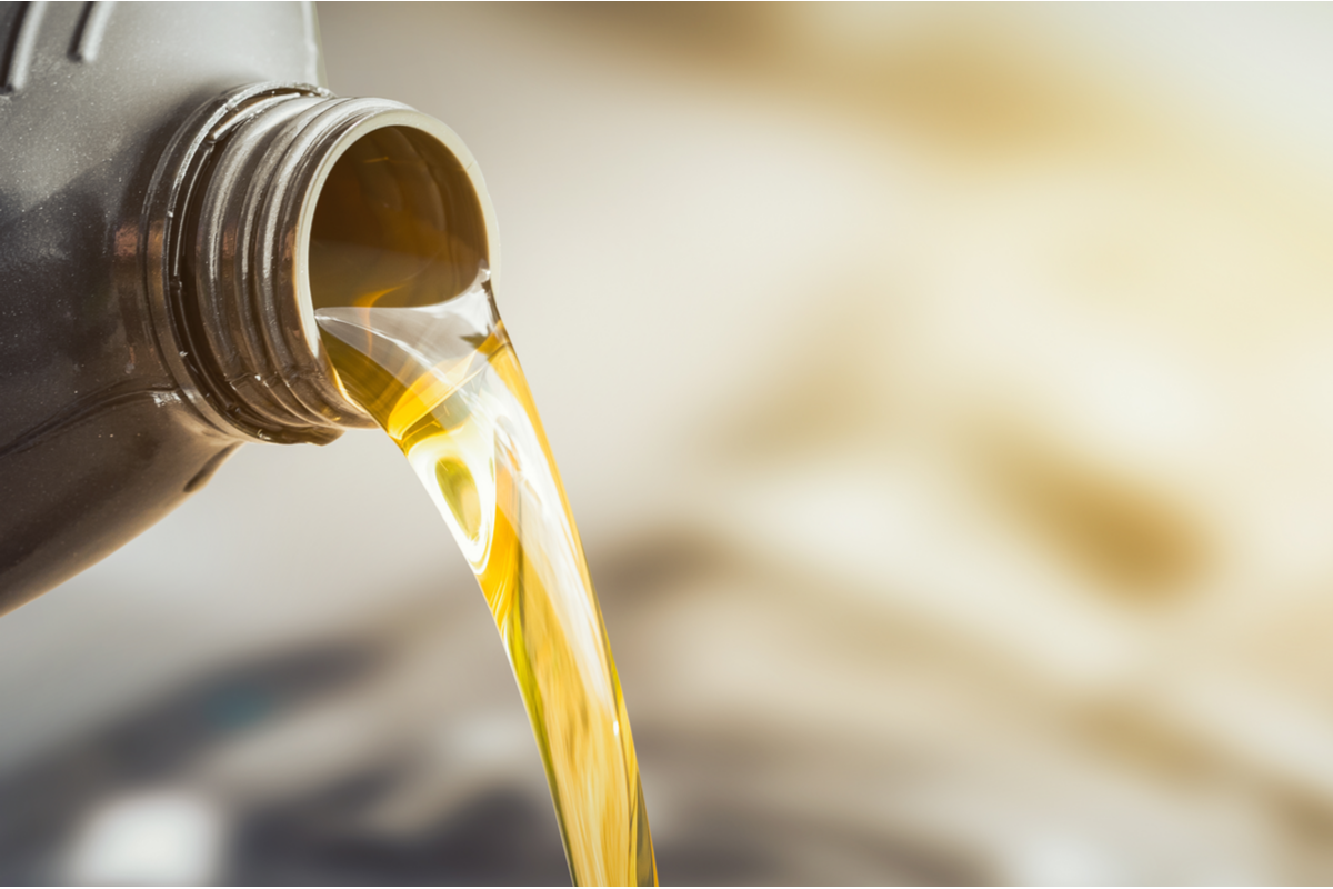 Oil being poured into a whole-home standby generator.