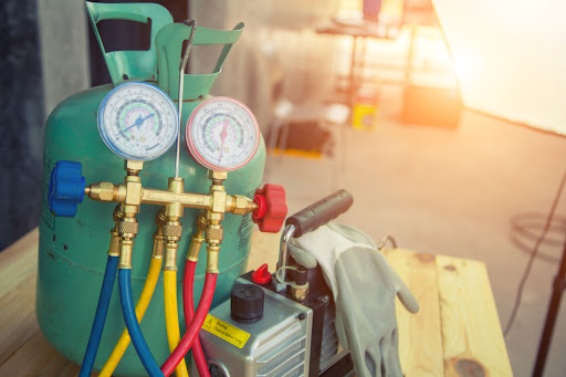 Refrigerant and AC tools placed near one another.