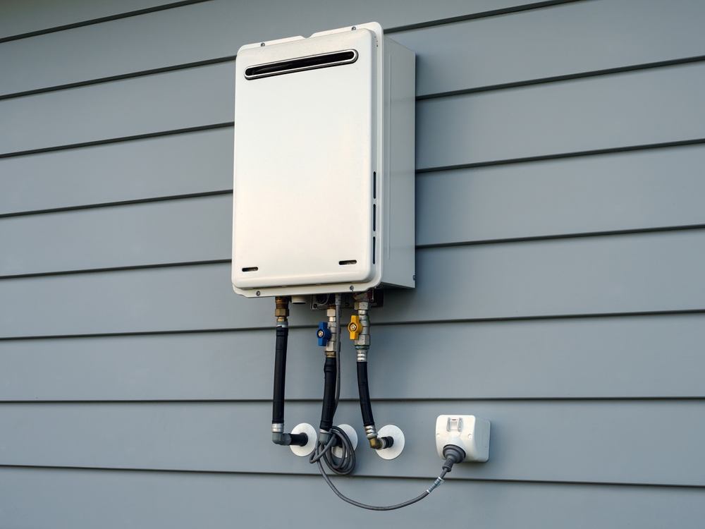 Tankless water heater hanging outside of New Orleans, LA home